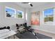 Bright workout room featuring two windows, a weight bench, a ceiling fan, and neutral decor at 468 44Th N Ave, St Petersburg, FL 33703