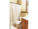 A neutral bathroom features a toilet, sink, vanity and shower at 5110 Corvette Dr, Tampa, FL 33624