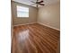 A cozy bedroom with wood floors and a ceiling fan at 5110 Corvette Dr, Tampa, FL 33624