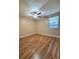 A spacious bedroom with beautiful wood floors and a ceiling fan at 5110 Corvette Dr, Tampa, FL 33624