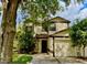 Charming two-story home features a well-manicured lawn, mature trees, and an attached two-car garage at 5110 Corvette Dr, Tampa, FL 33624