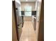 The kitchen features white cabinets and stainless appliances at 5110 Corvette Dr, Tampa, FL 33624