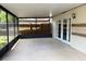 Enclosed porch area with screen walls and a covered ceiling providing a relaxing outdoor space at 5110 Corvette Dr, Tampa, FL 33624