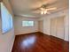 Cozy bedroom with hardwood floors, window and closet at 5390 Magnolia N Trl, Pinellas Park, FL 33782