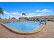Community swimming pool surrounded by lounge chairs for relaxing under the sun at 5390 Magnolia N Trl, Pinellas Park, FL 33782