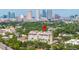 Wonderful aerial view of a stately building with a backdrop of the city skyline at 610 S Rome Ave # 602, Tampa, FL 33606
