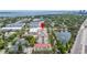 Overhead view of a multi-story property, positioned between a scenic lake and a bustling main road at 610 S Rome Ave # 602, Tampa, FL 33606