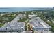 Aerial view showcases commercial real estate with ample parking space and lots of surrounding greenery at 610 S Rome Ave # 602, Tampa, FL 33606