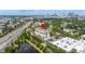 A beautiful building is surrounded by lush trees, nestled beside a pond and a busy highway at 610 S Rome Ave # 602, Tampa, FL 33606