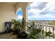 Relaxing balcony with decorative stone and greenery overlooking the parking areas and cityscape at 610 S Rome Ave # 602, Tampa, FL 33606