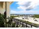 A high rise balcony is adorned with plants and overlooks a parking lot and commercial buildings at 610 S Rome Ave # 602, Tampa, FL 33606