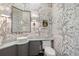 Chic powder room with marble vanity and elegant decorative wallpaper at 610 S Rome Ave # 602, Tampa, FL 33606