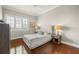 Comfortable bedroom with hardwood floors, neutral tones, and a large window for natural light at 610 S Rome Ave # 602, Tampa, FL 33606
