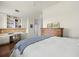 Bright bedroom featuring a desk area with built-in shelving and hardwood floors at 610 S Rome Ave # 602, Tampa, FL 33606