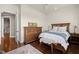 Comfortable bedroom featuring warm wood floors, ample natural light, and classic decor at 610 S Rome Ave # 602, Tampa, FL 33606