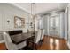 Bright dining room with decorative lighting, and access to the outdoors through French doors at 610 S Rome Ave # 602, Tampa, FL 33606