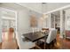 Open-concept dining room with modern light fixtures and view into the living area at 610 S Rome Ave # 602, Tampa, FL 33606