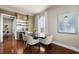Bright dining area featuring modern table, seating, wine fridge, and natural light at 610 S Rome Ave # 602, Tampa, FL 33606