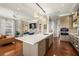 Open floor plan featuring kitchen island, stainless appliances, and spacious layout at 610 S Rome Ave # 602, Tampa, FL 33606
