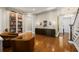 Open-concept living area with hardwood floors, built-in shelves, and elegant furnishings, creating a welcoming atmosphere at 610 S Rome Ave # 602, Tampa, FL 33606