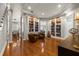 Spacious living room with built-in bookcases, hardwood floors, and recessed lighting, showcasing a cozy ambiance at 610 S Rome Ave # 602, Tampa, FL 33606