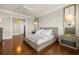A serene main bedroom with hardwood floors, neutral tones, and stylish furniture at 610 S Rome Ave # 602, Tampa, FL 33606