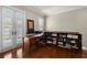 Spacious office with built-in bookshelves, hardwood floors, and shuttered French doors at 610 S Rome Ave # 602, Tampa, FL 33606