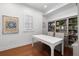 Bright home office with custom shelving and a large conference style table at 610 S Rome Ave # 602, Tampa, FL 33606