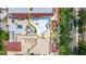 Aerial view of a spacious rooftop terrace with lounge seating, dining area, and lush landscaping at 610 S Rome Ave # 602, Tampa, FL 33606