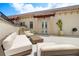 Inviting rooftop patio featuring lounge furniture, columns, potted cactus, and access to interior through French doors at 610 S Rome Ave # 602, Tampa, FL 33606