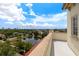Scenic rooftop view overlooking a tranquil lake, lush greenery, and the distant cityscape at 610 S Rome Ave # 602, Tampa, FL 33606