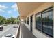 A serene view from a condo balcony overlooking the parking area and well-maintained landscaping in the community at 635 30Th W Ave # F309, Bradenton, FL 34205