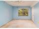 Bedroom with ceiling fan, closet, and a large window offering natural light and views at 635 30Th W Ave # F309, Bradenton, FL 34205