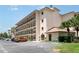 Exterior view of condo building featuring multiple levels, balconies, parking, and convenient handicap access at 635 30Th W Ave # F309, Bradenton, FL 34205
