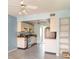 Kitchen with essential appliances, white cabinetry, and bright lighting, ready for culinary adventures at 635 30Th W Ave # F309, Bradenton, FL 34205
