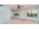 Inviting living room featuring natural light through windows, carpeted floor, and neutral walls, awaiting personal touches at 635 30Th W Ave # F309, Bradenton, FL 34205