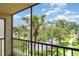 Screened in lanai area with picturesque view of the lake, palm trees and landscaped green space at 635 30Th W Ave # F309, Bradenton, FL 34205