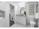 Modern bathroom features a granite countertop, ample mirror space, and walk-in closet access at 777 N Ashley Dr # 2312, Tampa, FL 33602