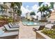 Beautiful pool deck with tropical landscaping and comfortable lounge chairs, providing a resort-like oasis at 777 N Ashley Dr # 2312, Tampa, FL 33602