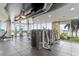 Well-equipped gym with modern fitness equipment and floor-to-ceiling windows, offering an invigorating workout space at 777 N Ashley Dr # 2312, Tampa, FL 33602
