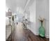Inviting condo hallway with stylish décor and hardwood floors leading into an open-concept kitchen and living area at 777 N Ashley Dr # 2312, Tampa, FL 33602