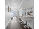 Modern kitchen with sleek white cabinets, granite countertops, stainless steel appliances, and stylish bar seating at 777 N Ashley Dr # 2312, Tampa, FL 33602