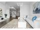Bright living room with modern decor, an open kitchen, and an inviting white sofa at 777 N Ashley Dr # 2312, Tampa, FL 33602
