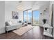 Bright living room boasting floor-to-ceiling windows, comfortable seating, and views of the city at 777 N Ashley Dr # 2312, Tampa, FL 33602