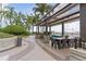 Charming roof deck boasts a dining table, outdoor lounge area, beautiful landscaping, and stunning city views at 777 N Ashley Dr # 2312, Tampa, FL 33602