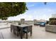 Beautiful roof deck with dining table, outdoor lounge area, and stunning city views at 777 N Ashley Dr # 2312, Tampa, FL 33602