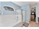 Bathroom featuring separate shower and tub with tile surround and natural light at 7809 E 114Th Ave, Temple Terrace, FL 33617