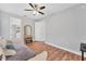 Bedroom with wood floors, trundle bed, closet, and a vanity and mirror at 7809 E 114Th Ave, Temple Terrace, FL 33617