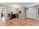 Inviting foyer with stylish wood flooring, bar table, and abundant natural light at 7809 E 114Th Ave, Temple Terrace, FL 33617