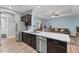Modern kitchen showcasing marble countertops, stainless steel appliances, and an open design at 7809 E 114Th Ave, Temple Terrace, FL 33617